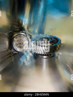 gear wheel is machined on a horizontal CNC machine center with  rotating tool and splashing coolant