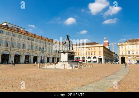 Turin, Italy, September 10, 2018: Piazza San Carlo square with Emanuele Filiberto monument and buildings in old historical city centre with blue sky white clouds background, Torino, Piedmont Stock Photo
