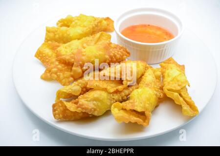 Deep Fried Won ton on white plate with dip source Stock Photo