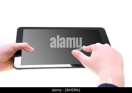 Boy playing on tablet with black screen Stock Photo