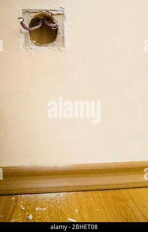 Replacing old power socket, electrical junction box with wires Stock Photo
