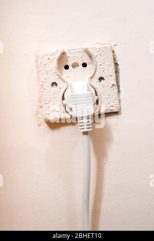 Old power socket with electric cable plug Stock Photo
