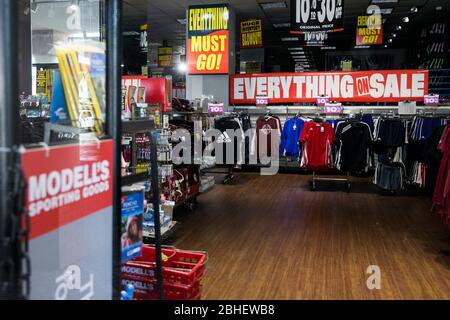 'Everything Must Go' signage inside a Modell's Sporting Goods retail that is being liquidated store location in Bethesda, Maryland on April 22, 2020. Stock Photo