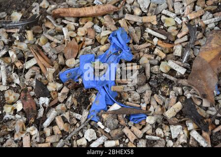 Tunis, Tunisia. 25th Apr, 2020. A used latex plastic gloves on the side of the street during quarantine.At this time of the corona virus contagion, latex gloves and surgical masks are abandoned by people in parking lots, grassy fields, playgrounds and in the streets. Many with the potential to carry the Covid-19 virus inside. Credit: SOPA Images Limited/Alamy Live News Stock Photo