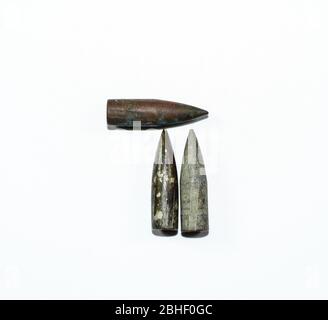 Old rusty bullets from a Kalashnikov assault rifle. Stock Photo