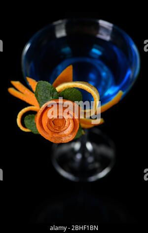 Art in orange- fruits carving. How to make to citrus garnish design for a drink. Stock Photo