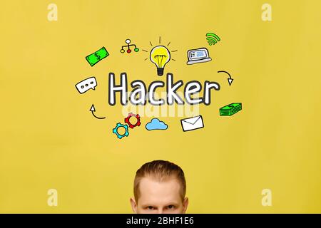 Hacker concept with portrait man with text and icons on a yellow background. Close up. Stock Photo