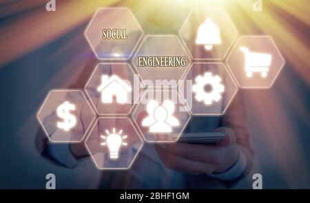 Writing note showing Social Engineering. Business concept for Psychological Manipulation Gain Access thru Fraud Stock Photo