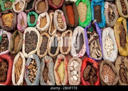 Bags of various spices, seeds and ingredients at the bazaar in Yarken town, south of Taklamakan desert. Xinjiang province, west China Stock Photo