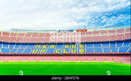 Barcelona, Spain, March 14, 2019: Camp Nou is the home stadium of football club Barcelona, the largest stadium in Spain. View of tribunes stands and green grass field from reserves bench. Stock Photo
