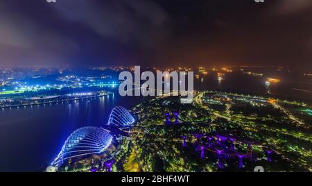 Aerial view of Cloud Forest, the Flower Dome, and the Supertree Grove in Gardens by the Bay, Singapore at sunrise Stock Photo