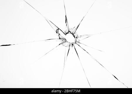 Broken glass texture with hole in center isolated on white background Stock Photo