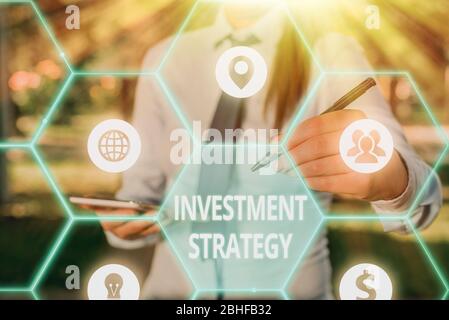 Writing note showing Investment Strategy. Business concept for Set of Rules Procedures Behavior a Guide to an Investor Stock Photo