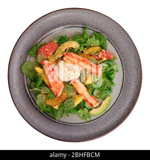 Crab meat with corn salad and citrus wedges isolated on white background Stock Photo