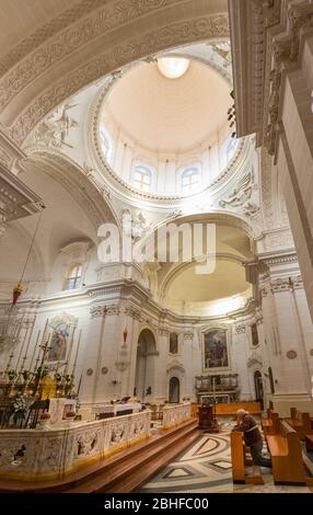 Man praying in The Sanctuary of Our Lady of Mellieha, Mellieha, Malta Stock Photo