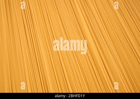 background of dry uncooked spaghetti pasta close-up Stock Photo
