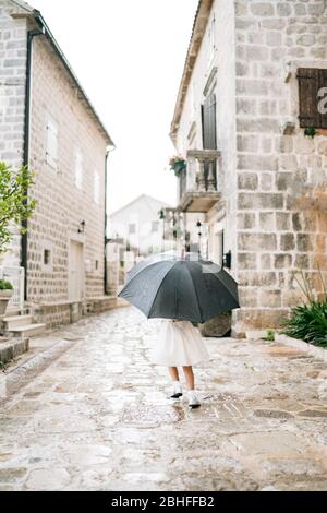 Photo Of Woman In Denim Shorts Holding Umbrella · Free Stock Photo