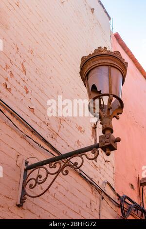 Old Street Light on a Wall in the Medina of Marrakesh Morocco Stock Photo