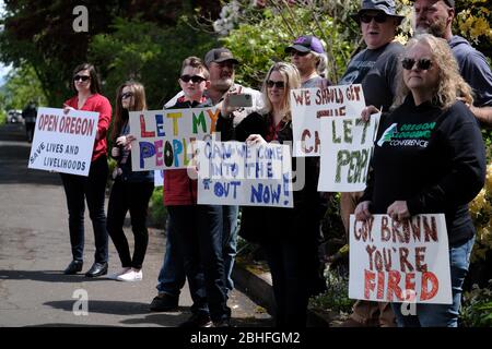 Salem, USA. 25th Apr, 2020. Protesters gather outside Governor Kate Brown's residence in Salem, Ore., on April 25, 2020, calling for novel coronavirus restrictions to be lifted so that people can get back to work. (Photo by Alex Milan Tracy/Sipa USA) Credit: Sipa USA/Alamy Live News Stock Photo