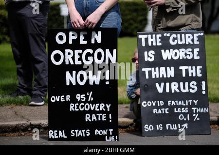 Salem, USA. 25th Apr, 2020. Protesters gather outside Governor Kate Brown's residence in Salem, Ore., on April 25, 2020, calling for novel coronavirus restrictions to be lifted so that people can get back to work. (Photo by Alex Milan Tracy/Sipa USA) Credit: Sipa USA/Alamy Live News Stock Photo