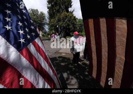 Salem, USA. 25th Apr, 2020. Protesters gather outside Governor Kate Brown's residence in Salem, Ore., on April 25, 2020, calling for novel coronavirus restrictions to be lifted so that people can get back to work. (Photo by Alex Milan Tracy/Sipa USA) Credit: Sipa USA/Alamy Live News Stock Photo