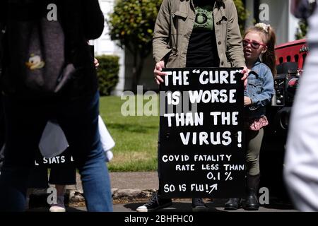 Salem, USA. 25th Apr, 2020. Protesters gather outside Governor Kate Brown's residence in Salem, Ore., on April 25, 2020, calling for novel coronavirus restrictions to be lifted so that people can get back to work. (Photo by Alex Milan Tracy/Sipa USA) Credit: Sipa USA/Alamy Live News Stock Photo