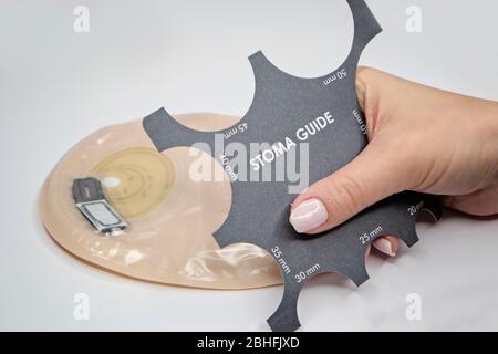 Top view on colostomy bag, supplies needed after colostomy surgery - colon cancer treatment. Ostomy bag with filter in skin color. Medical theme. Stom Stock Photo