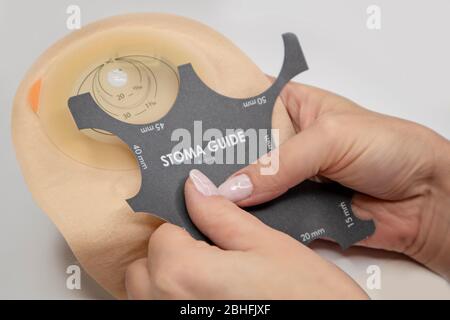 Top view on colostomy bag, supplies needed after colostomy surgery - colon cancer treatment. Ostomy bag with filter in skin color. Medical theme. Stom Stock Photo