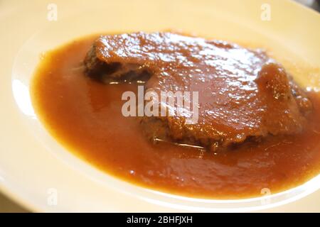 Boiled meat of veal and beef with vegetable sauce Stock Photo