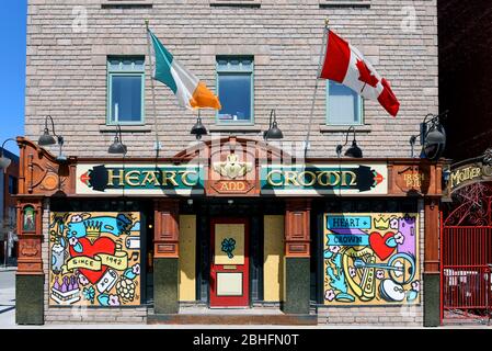 Ottawa, Canada - April 25, 2020: The popular bar The Heart and Crown is boarded up during the COVID-19 lockdown measures but commissioned local artist Stock Photo