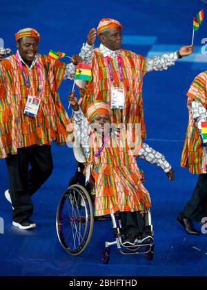 London England, August 29 2012: A Paralympic athlete from Ghana waves to the crowd at the Opening Ceremonies of the 2012 London Paralympic Games.  ©Bob Daemmrich Stock Photo