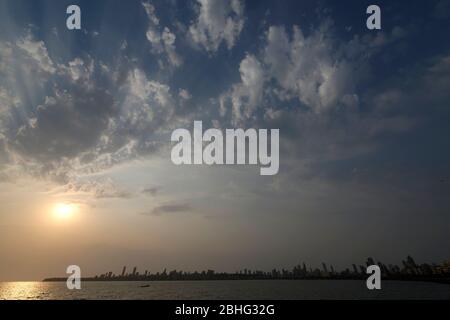 Beautiful clouds and sun rays in evening at sunset from Marine Drive the Queen's necklace, Mumbai, Maharashtra, India. Stock Photo