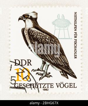 SEATTLE WASHINGTON - April 25, 2020: DDR postage stamp promoting the use of nesting aids for endangered bird of prey Osprey. Scott # 2265