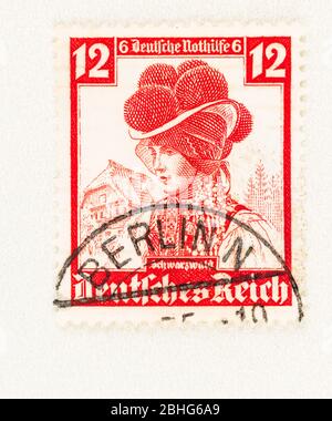 SEATTLE WASHINGTON - April 25, 2020: German Reich stamp  featuring  Gutachtal woman with bollen hat, a traditional headdress of the Balck Forest. Scot