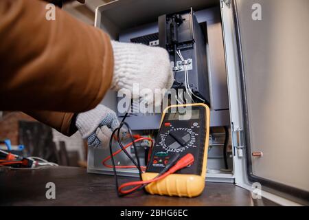 Checking electrical panel and power cable for short circuit Stock Photo