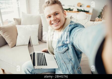 Business young man freelancer in quarantine for coronavirus working computer from home Stock Photo