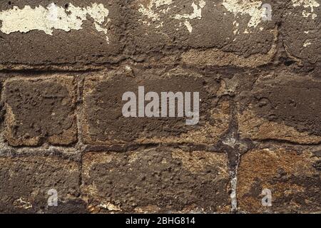 Fallen plaster on house wall background Stock Photo