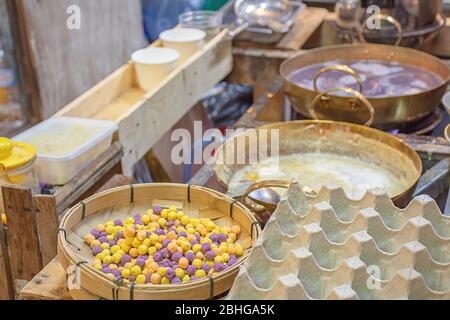 Thai dessert or Bua loi , Dumplings rice ball on bamboo tray and coconut milk. Stock Photo