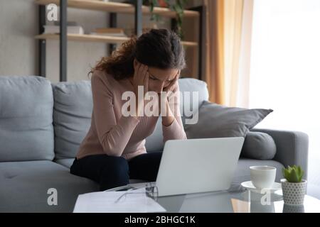 Upset lady tired of hard computer work. Stock Photo