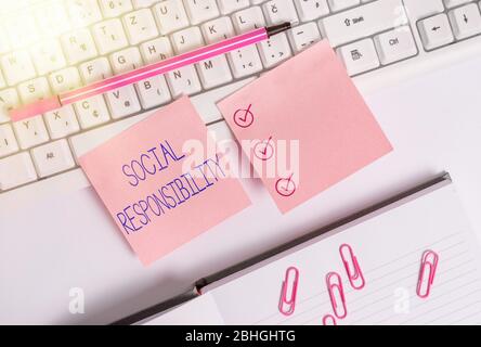 Handwriting text Social Responsibility. Conceptual photo Obligation for the Benefit of Society Balance in life Flat lay above blank copy space sticky Stock Photo