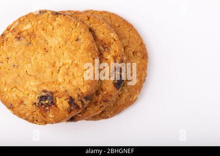 Delicious Oat cookies raisins with wholegrain on a white background. Stock Photo