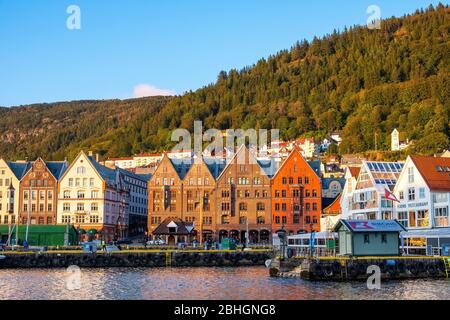 Bergen, Hordaland / Norway - 2019/09/03: Panoramic view of historic Bryggen district at the Bergen harbor with Floyen Mountain in background Stock Photo