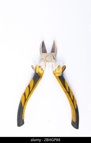 Side cutters with yellow and grey handle on white background. Stock Photo
