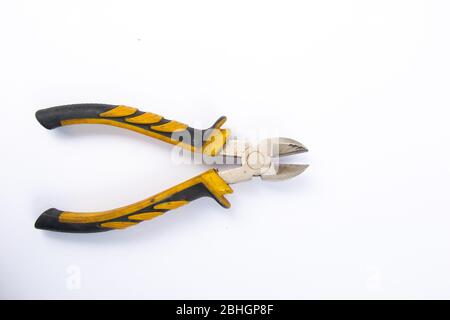 Side cutters with yellow and grey handle on white background. Stock Photo