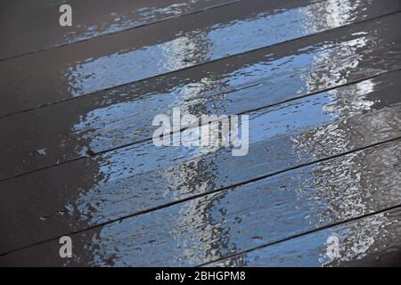 Wet painted floor reflects light from a window Stock Photo