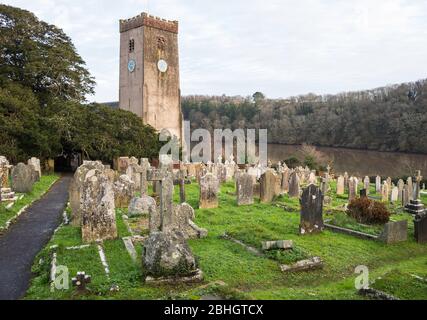 The Church of St Mary and St Gabriel overlooks Mill Pool in the village of Stoke Gabriel, Devon, England, UK. Stock Photo
