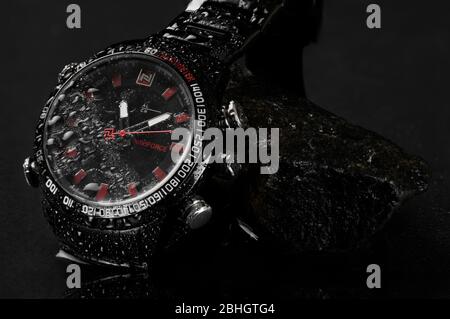 Egypt, Alexandria  Naviforce watch on a navy belt and jacket Stock Photo