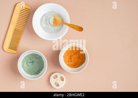 Set of clay masks in bowls for face and hair treatment. Flat lay, top view. SPA natural organic cosmetic products, skincare concept Stock Photo