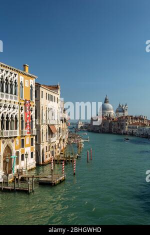 The Grand canal and the Basillica of Santa Maria della Salute viewed from Academia bridge in Venice. Stock Photo