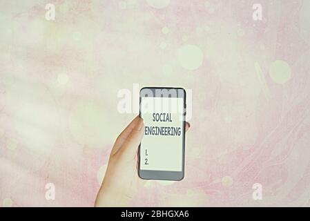 Writing note showing Social Engineering. Business concept for Psychological Manipulation Gain Access thru Fraud Stock Photo